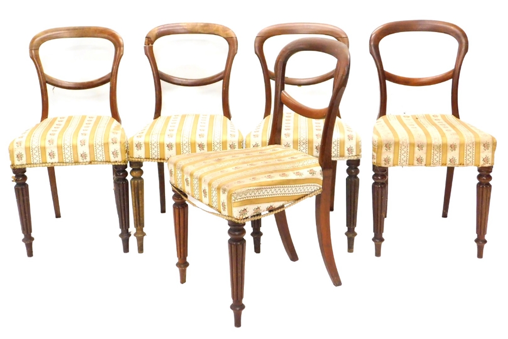 A set of five Victorian mahogany balloon back dining chairs, each with a padded seat, on turned