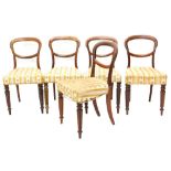 A set of five Victorian mahogany balloon back dining chairs, each with a padded seat, on turned