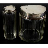 Two associated Edward VII glass and silver mounted dressing table jars, the larger inscribed to