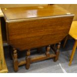 An oak dropleaf table, with moulded edge.