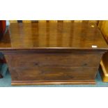 A stained pine blanket box, with fabric lined interior and metal side handles, 90cm wide.