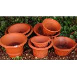 A quantity of terracotta plant pots.