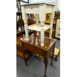 A Singer electric sewing machine in a walnut sewing machine table on cabriole legs, a brass standard