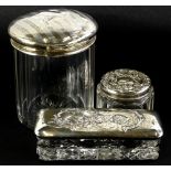 Two George V glass and silver mounted dressing table jars, Birmingham 1905 and 1920, and another