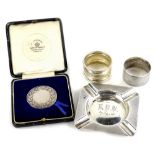 A collection of small silver, to include two napkin rings, an ashtray with engine turned