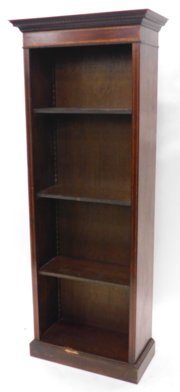 An Edwardian style mahogany and inlaid open bookcase, the top with a moulded and dental cornice,