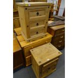 A pair of pine three drawer chest of drawers, and another pine chest of four drawers.