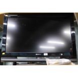 A Sony Bravia 31" TV, with lead and remote.