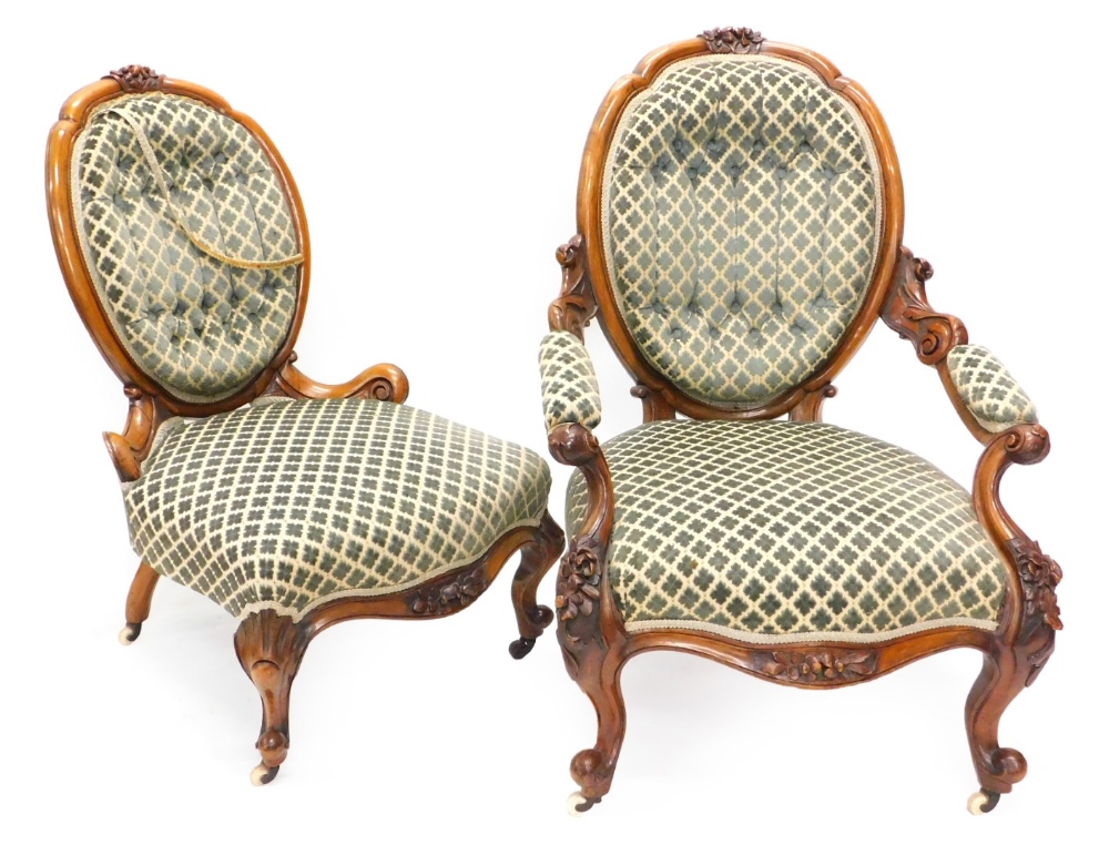 A Victorian walnut show frame gentleman's open armchair, with a padded back, arm rests and seat,