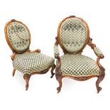 A Victorian walnut show frame gentleman's open armchair, with a padded back, arm rests and seat,