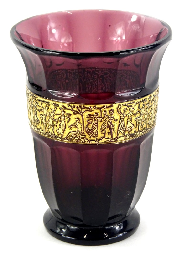 A Moser type purple tinted moulded glass vase, decorated with figures in relief, picked out in gilt,