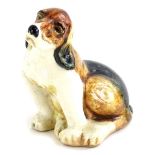 A mid 20thC pottery model of a Beagle, handwritten number 8 to underside, no factory mark, 10cm
