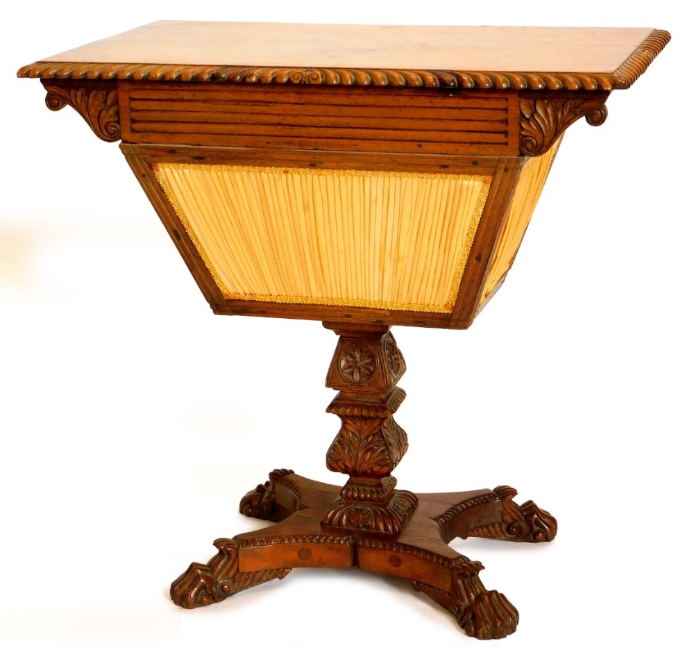 An early 19thC Anglo Indian work table, the rectangular top with a gadrooned border above a reeded