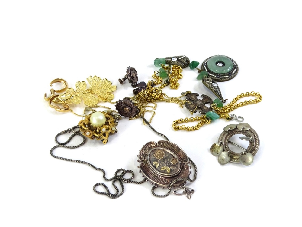 A quantity of costume jewellery, to include a Victorian silver brooch decorated in yellow metal with