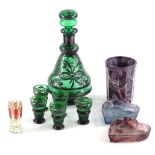 A collection of coloured glass, to include a slag glass beaker, two heart shaped dishes, a