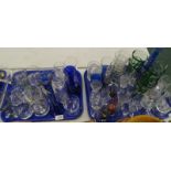 Glassware, to include a blue glass candlestick, drinking glasses, blue glass vase, etc. (2 trays)
