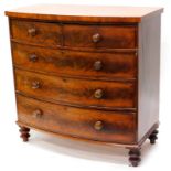 A Victorian mahogany bow fronted chest of drawers, with a plain figured top above two short and