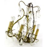 A brass six branch chandelier, suspended with tear drop and pear shaped cut glass drops, etc.,