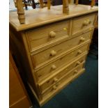 A pine chest of two short and four long drawers, with turned wooden handles, on a plinth, 92cm