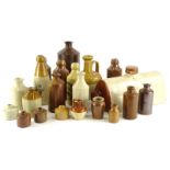 A collection of stoneware, to include bottles, jugs, and a bed warmer.