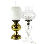 A cut glass table lamp, with thistle shaped shade and silver plated mounts, 46cm high, and a brass