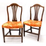 A pair of 19thC elm side chairs, each upholstered in oriental style fabric, on square tapering