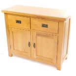 A light oak sideboard, with two drawers over a pair of cupboard doors, raised on block feet, 86cm