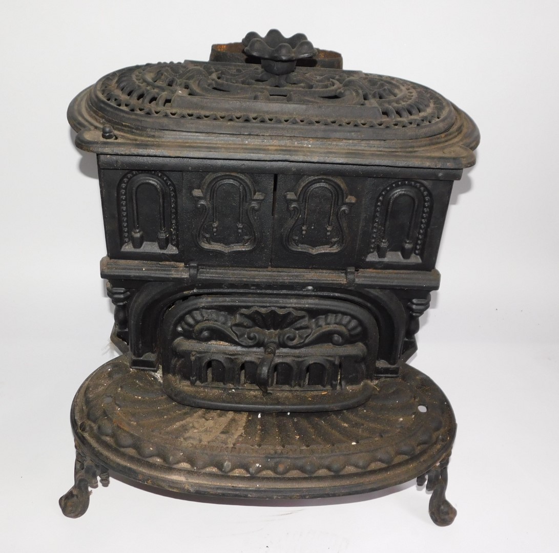 A Victorian cast iron kitchen range by The Columbian Stove Works., of oval form, with a pierced