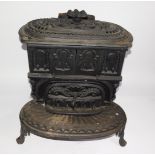 A Victorian cast iron kitchen range by The Columbian Stove Works., of oval form, with a pierced