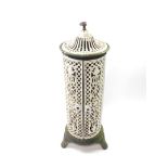 A Victorian white and green cast iron cathedral heater by Nestor Martin, with pierced floral and