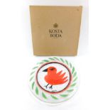 A Kosta Body Somebody glass dish, designed by Ulrica Hydman-Vallien, painted with a red bird