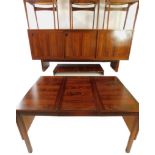 A Danish 1970's rosewood composite dining suite, comprising a rosewood drop and draw leaf