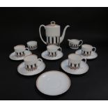 A Susie Cooper porcelain part coffee service decorated in the Corinthian pattern, C2056, printed