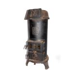 A Belgian early 20thC cast iron pot belly stove, Etna Sun 1028, 83cm high, 30cm diameter.