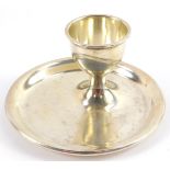 A George V silver egg cup, with integral saucer, Birmingham 1928, 3.51oz.