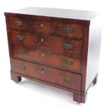 An early mahogany chest of four long graduated drawers, raised on block feet with later castors,