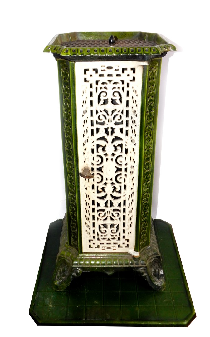 A French early 20thC cast iron and enamel conservatory heater, of canted square form, with pierced