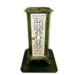 A French early 20thC cast iron and enamel conservatory heater, of canted square form, with pierced