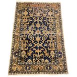 A Baluchi rug, blue ground decorated with floral and geometric motifs within repeating borders,