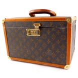 A Louis Vuitton style combination jewellery case, with tan leather trim, 20.5cm high, 32cm wide,