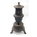 A Victorian cast iron stove, of cylindrical baluster form with cast leaf and other decoration,