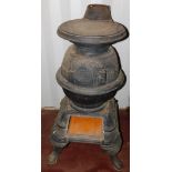 A Pittsburgh late 19thC cast iron Mk II pot belly stove, raised on four cabriole legs, 91cm high,