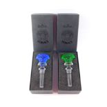 A pair of Rosenthal Versace crystal Medusa bottle stoppers, Treasury Series, one moulded in green