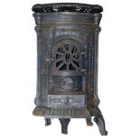 A Victorian cast iron stove, of bowed form, raised on four cabriole legs, 80cm high, 42cm wide, 31cm