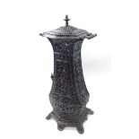 A Victorian cast iron cathedral heater, of twin handled baluster form, with pierced and embossed