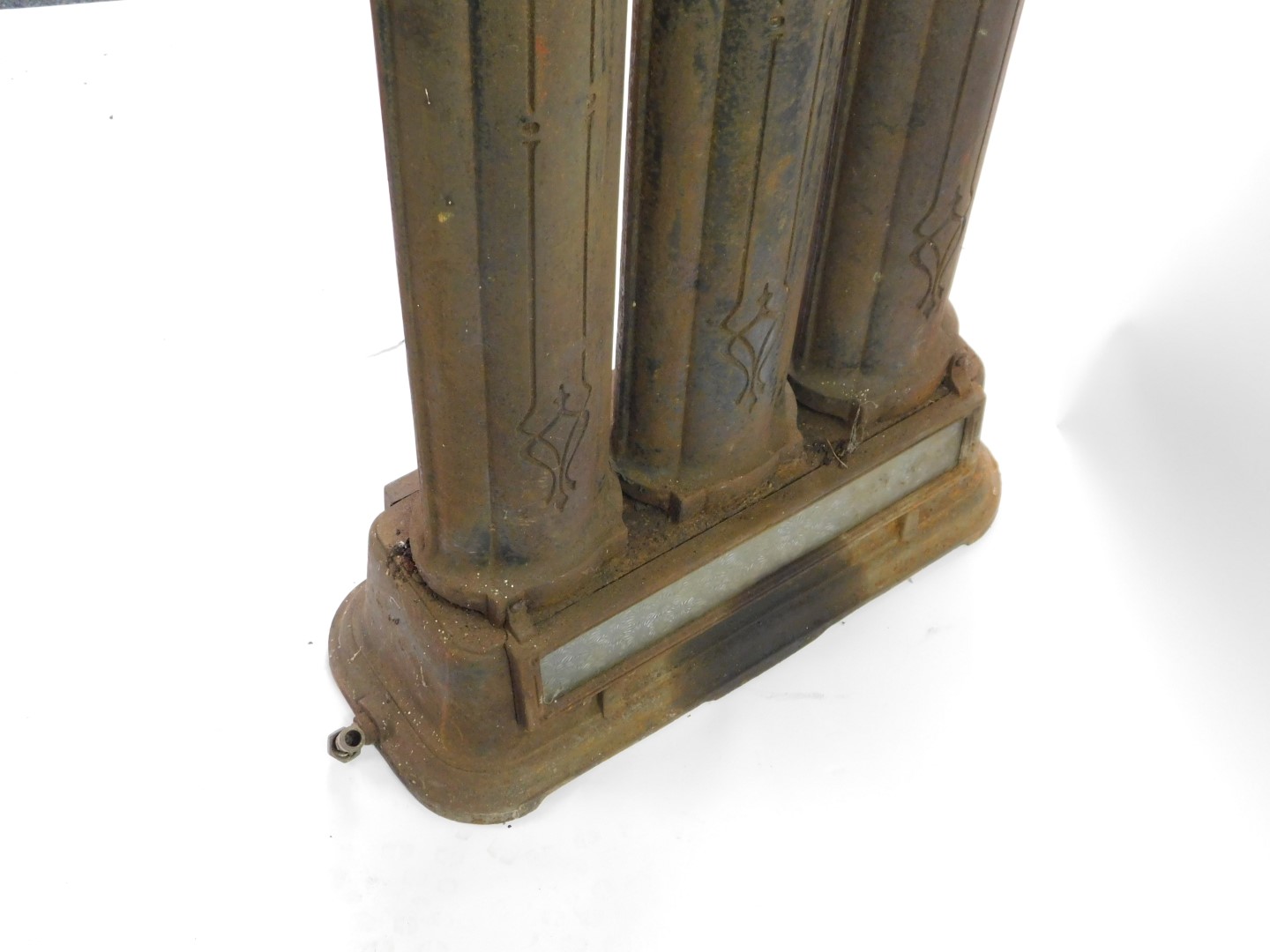 A Victorian cast iron oil and gas radiator, of three column form, above a glass paneled drop - Image 4 of 4