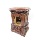 A Continental late 19thC brown stoneware and cast iron floor heater, of rectangular architectural