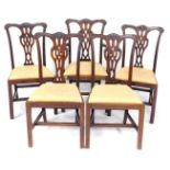 A set of five Chippendale style mahogany dining chairs, early 20thC, with leaf carved crest rail,