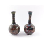 A matched pair of Chinese 19thC cloisonne vases, of long necked globular form, decorated with