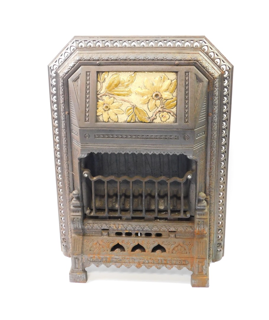 A Victorian cast iron and enamel gas heater by T Fletcher of Warrington, cast with leaves, the